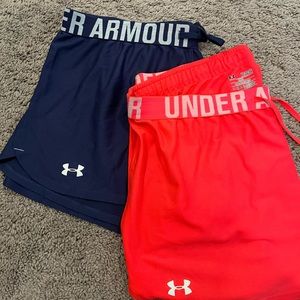 TWO pairs of Under Armour shorts (hot pink and navy blue)